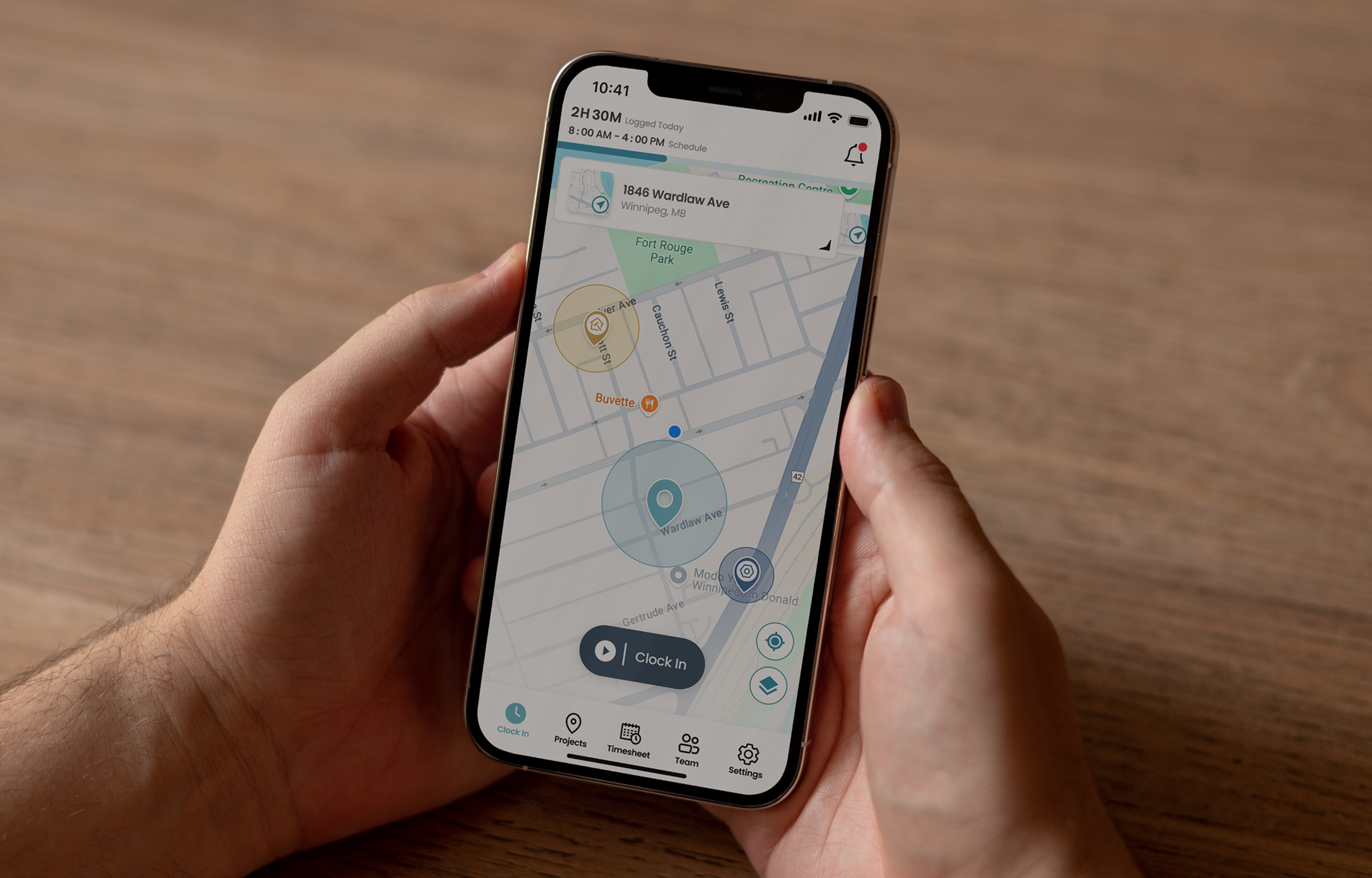 The Supercrew app open on a phone, showing a crew member clocked in at a job site